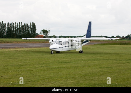 Britten-Norman BN2A Islander G-AWNT taxiing in after landing at Wickenby Airfield Stock Photo