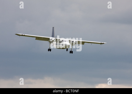 Britten-Norman BN2A Islander G-AWNT on final approach to land at Wickenby Airfield Stock Photo