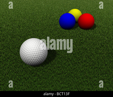 colored golf balls on green grass Stock Photo