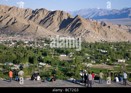 People contemplating Leh city from Shanti Stupa viewpoint. Leh. Ladakh. India Stock Photo