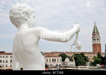 Venice, Veneto, Italy: statue of a boy holding a frog at art exhibit of biennale Stock Photo