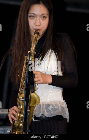 japanese oriental woman saxophonist jazz ska band Lambeth Country Show, Brockwell Park, Tulse Hill, London, England, UK, Europe Stock Photo