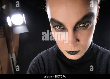 Studio headshot of a young woman with smoked eyes make up Stock Photo