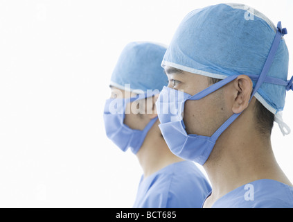 Surgeons wearing surgical gowns Stock Photo