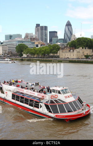 City Cruises, Millennium City pleasure cruiser on the River Thames at Tower Bridge, London, England, U.K.