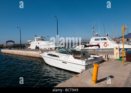 Yachts moored on the jetty at the Venetian harbour in Chania, Crete, Greece. Stock Photo