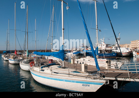 Yachts moored on the jetty at the Venetian harbour in Chania, Crete, Greece. Stock Photo