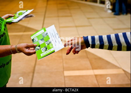 A volunteer from the Samaritans handing out leaflets. Stock Photo