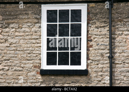 a former window blocked up to avoid the historic window tax Stock Photo