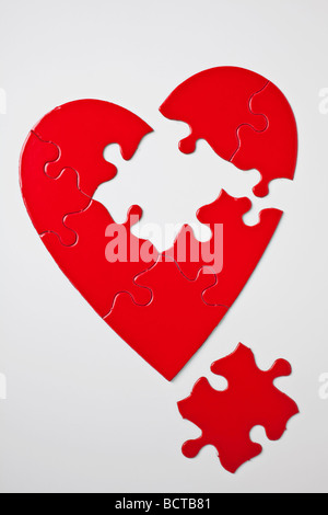 Red heart puzzle on white background Stock Photo