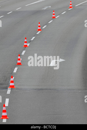 Traffic cones dividing a road lane Stock Photo