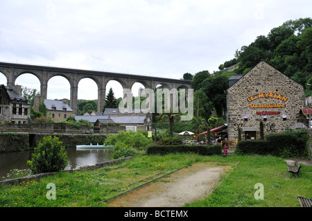 Le Myrian Bar Restaurant and bridge in the area of the French town of Dinan known as the port of Dinan on the river Rance Stock Photo