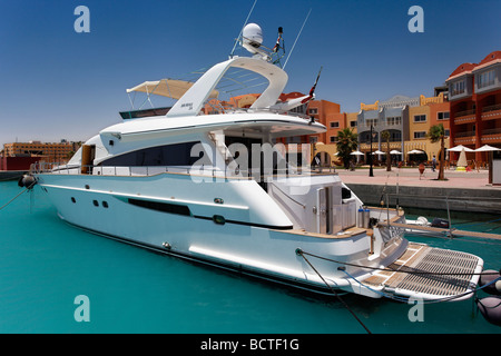 Private yacht in front of houses in the marina, Hurghada, Egypt, Red Sea, Africa Stock Photo