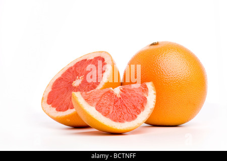 Sliced grapefruit on a white ground. Stock Photo