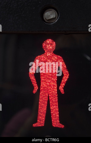 Britain UK Close up of illuminated red man stop and wait symbol on a pedestrian crossing Stock Photo