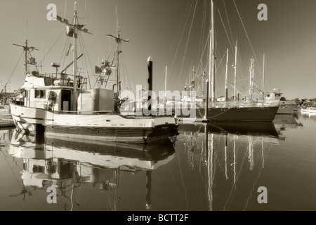 Boats in Brookings Harbor with reflection Oregon Stock Photo