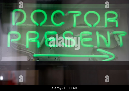 doctor present neon sign in the window of a chemists shop in dublin republic of ireland Stock Photo