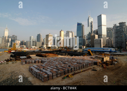 Land reclamation area of the land reclamation project in front of the skyline of Central Hong Kong with Bank of China, Asia Bui Stock Photo