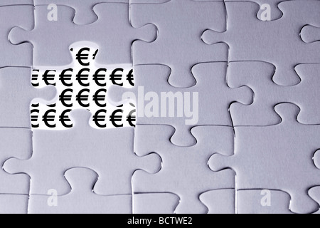 Jigsaw puzzle with Euro signs. Stock Photo