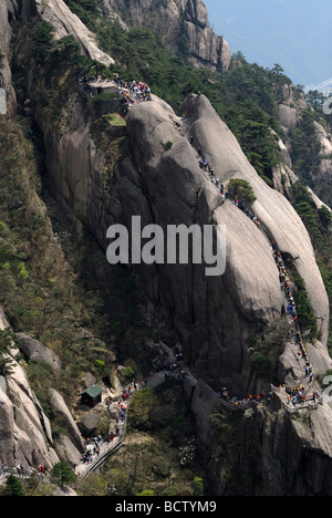 People, hikers on the stone stairs to the western sea in the mountains of Huangshan, Turtle Peak, Huang Shan, Anhui, China, Asia Stock Photo