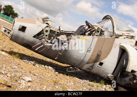 Aircraft plane wreck former RAF Harrier jump jet lying wrecked and smashed with many parts missing Stock Photo