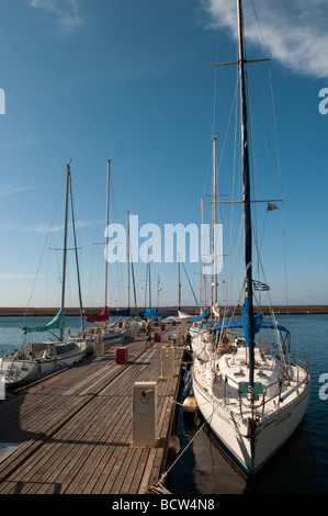 Yachts moored on the jetty at the Venetian harbour in Chania, Crete, Greece. Stock Photo