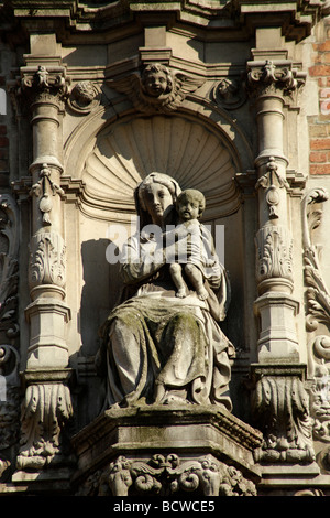 Mary with child on the facade of the Belfried, on Grote Markt market square, historic centre of Bruges, Belgium, Europe Stock Photo