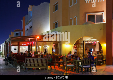 Street restaurant with people, evening, illuminated, marina, Hurghada, Egypt, Red Sea, Africa Stock Photo