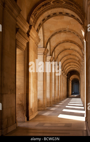 Arched walkway around the courtyard of Musee du Louvre, Paris France