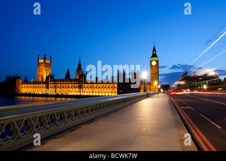 The Houses of Parliament with traffic light streams on Westminster bridge. Stock Photo