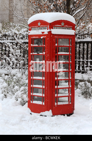 Snow covered telephone box by St Paul's Cathedral, London Stock Photo