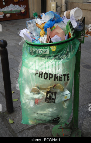 litter bin on Parisian street corner Paris France Stock Photo