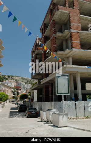 unfinished buildings are seen everywhere in Saranda (or Sarande) in Albania as old is being replaced with new Stock Photo