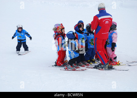 young children in ski class on mountain slope Zillertal Tirol Stock Photo