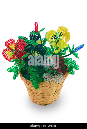 Handmade article: vase with flowers from glass beads and wire. Yellow, blue, pink, white bud. Green foliage. Birch bark bowl. Stock Photo