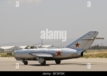 A MiG-15 taxis on runway after landing at an airshow. Stock Photo