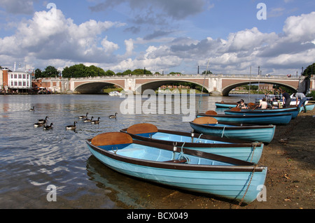 Hire boats and Hampton Court Bridge, River Thames, East Molesey, Surrey, England, United Kingdom Stock Photo