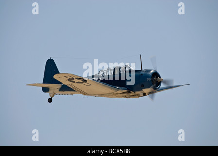 A Douglas SBD-5 Dauntless flies at an air show. Stock Photo