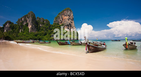 Longboats lined up on Railay Beach, Thailand Stock Photo