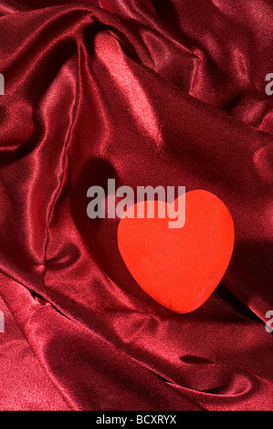 Red heart on the bed Stock Photo