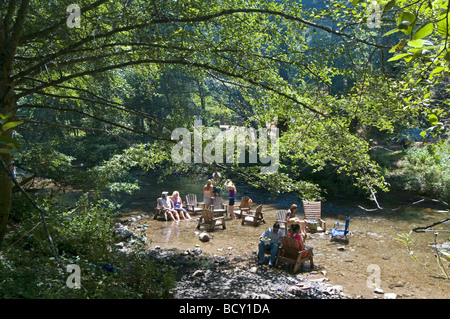 People sitting in the Big Sur river at the River Inn Stock Photo