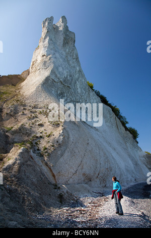 Woman in front of Møns Klint chalk cliffs, Møn Island, Denmark, Europe Stock Photo