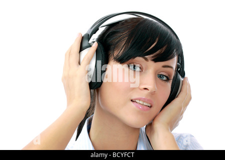 Junge Frau hoert Musik mit Kopfhoerer portrait of a young woman listening to music with headphone Stock Photo