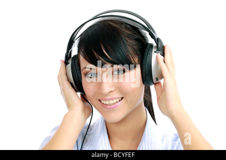 Junge Frau hoert Musik mit Kopfhoerer portrait of a young woman listening to music with headphone Stock Photo