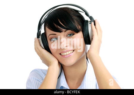 Junge Frau hoert Musik mit Kopfhoerer portrait of a young woman listening to music with headphone Stock Photo