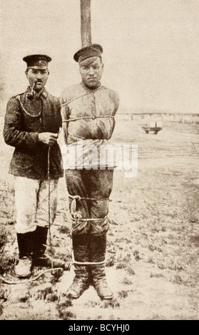 A First World War russian prisoner of war tied to a pole.  In the British Army this was called Field Punishment No 1. Stock Photo