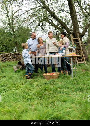 People eating applecake with basket Stock Photo