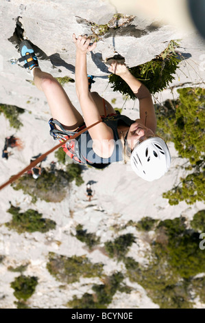 Woman rock climbing Stock Photo