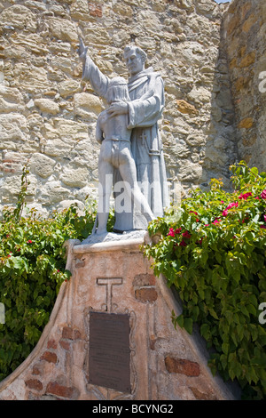 Statue of Father Junipero Serra and Indian Boy, Mission San Juan Capistrano, Orange County, California, USA Stock Photo