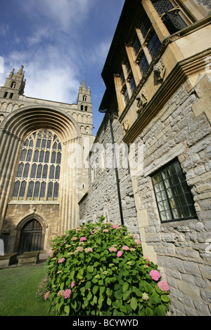 Town of Tewkesbury, England. Side view of the Abbey House with Tewkesbury Abbey west elevation and entrance in the background. Stock Photo